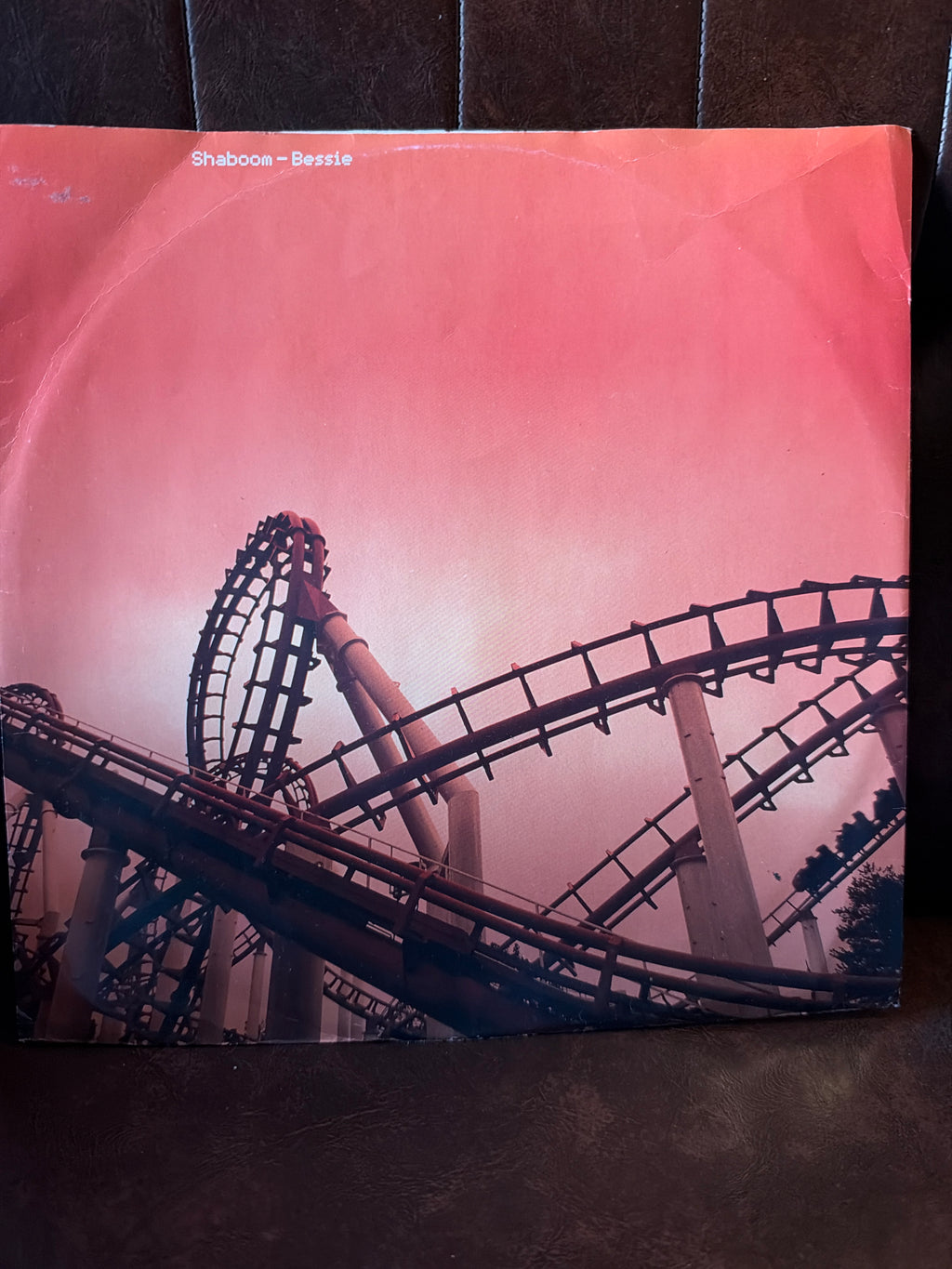 Shaboom Bessie 12 inch vinyl single, picture sleeve featuring roller coaster silhouette against a pink and red sky