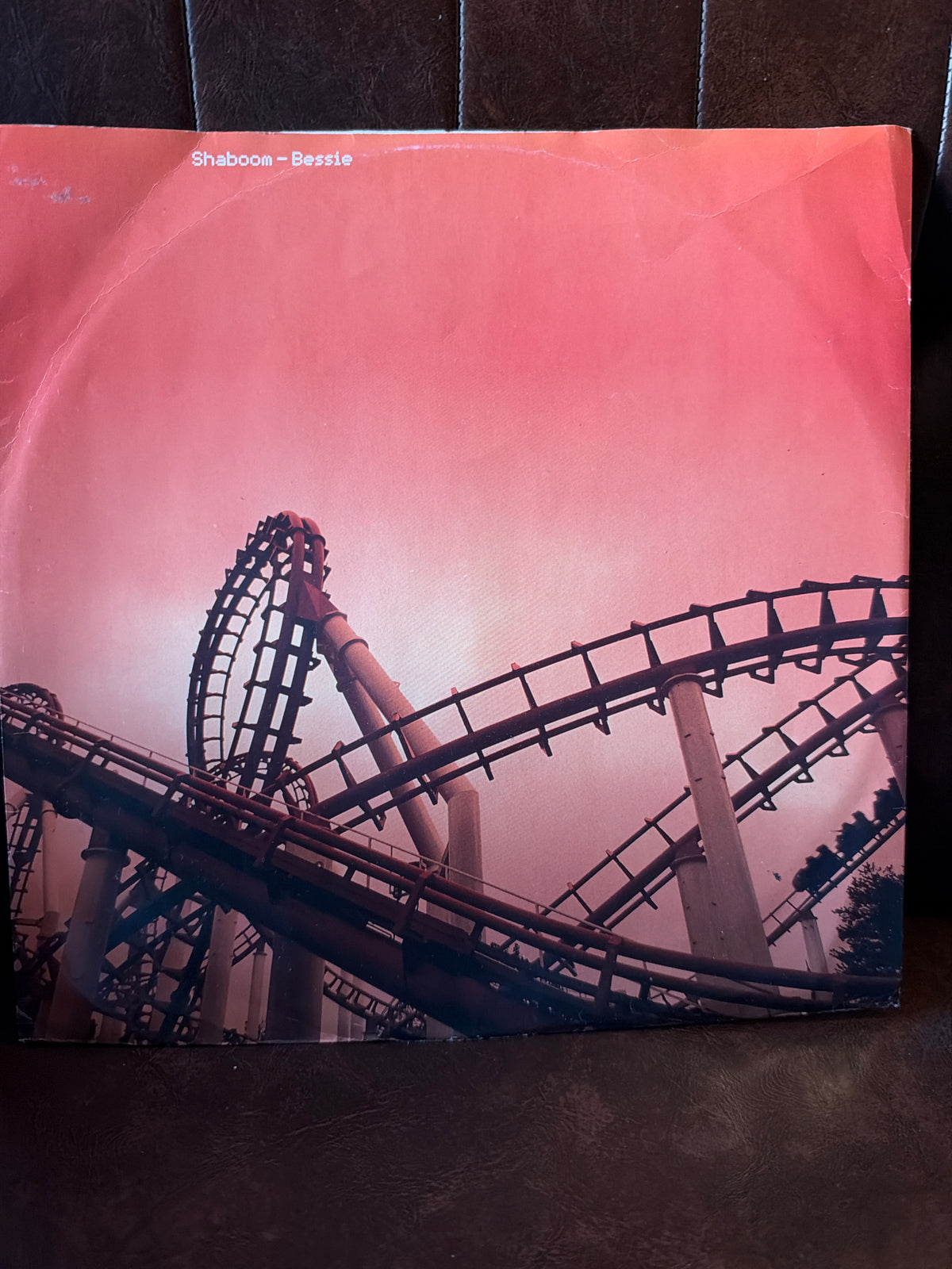 Shaboom Bessie 12 inch vinyl single, picture sleeve featuring roller coaster silhouette against a pink and red sky